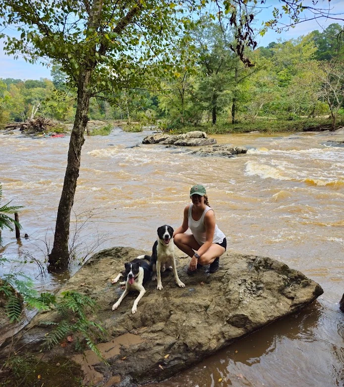 Brittanie outdoors with her dogs